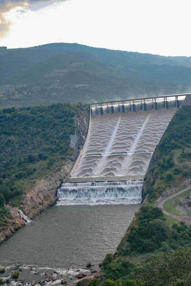 Aerial view of water flowing over the Maguga dam, Eswatini