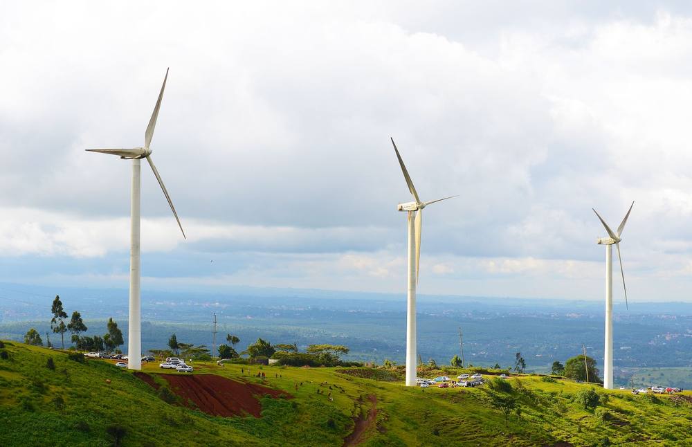 Wind turbines on a green hill in Kajiado County, Kenya